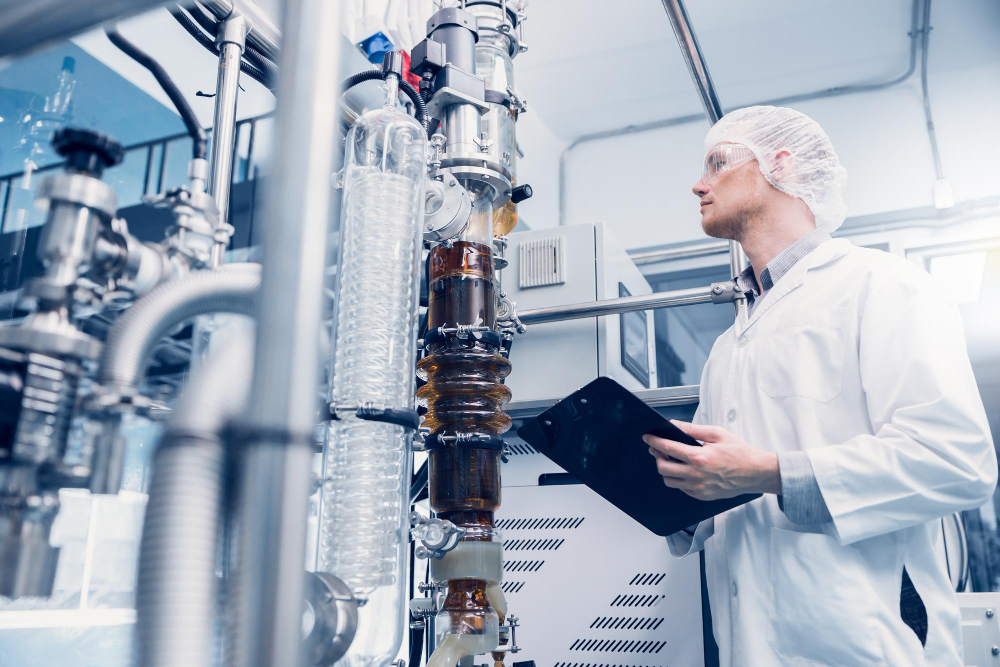 A worker in Chemical Manufacturing company checking the quality of the chemicals - The Benefits of ERP for Chemical Manufacturing