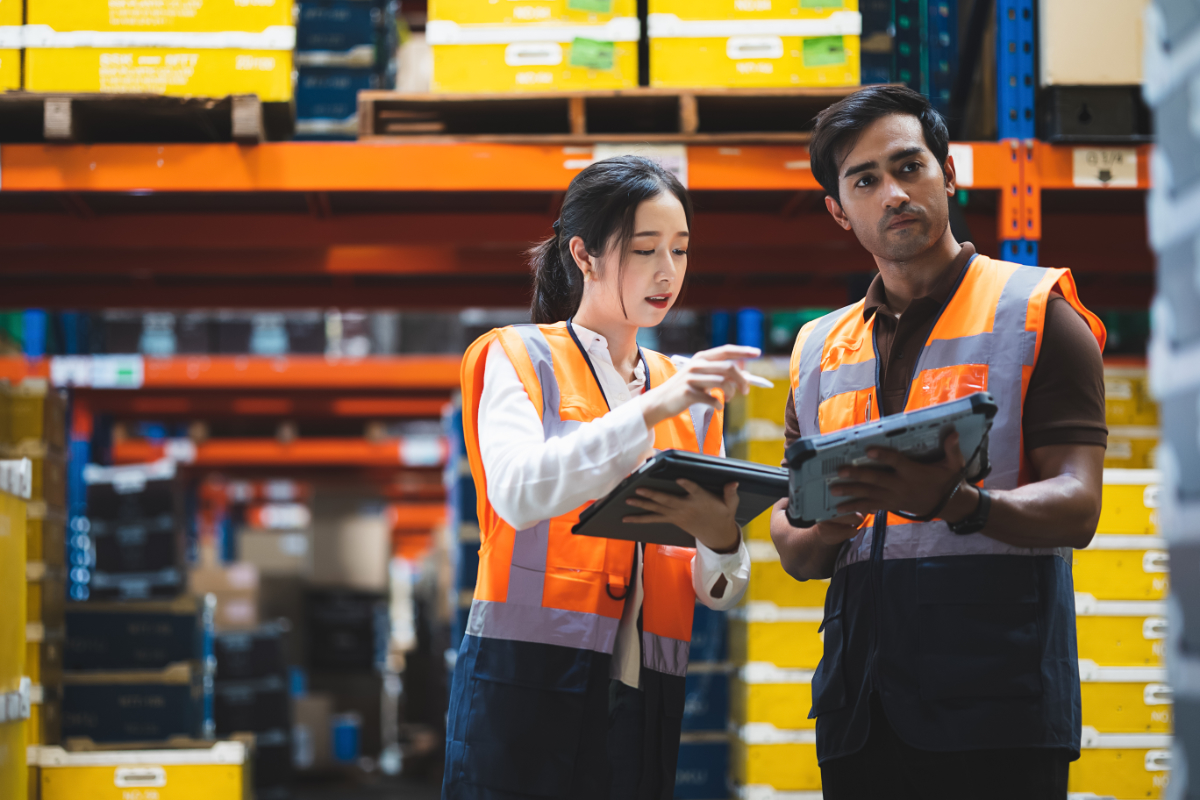 Warehouse worker and manager checks stock and inventory with using Sage X3 ERP from Panni - How to Use ERP Systems to Drive Sustainable Distribution