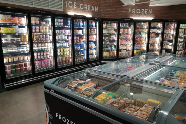 Huge glass fridge with various brand frozen food and ice cream - Top 4 Benefits Of Sage X3 Food Traceability Software blog featured image - Panni Management